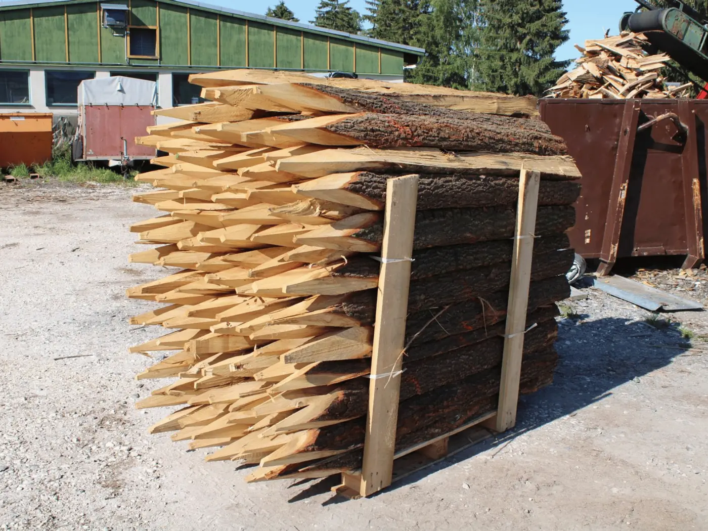 Oak cleft posts pointed, stacked in the yard